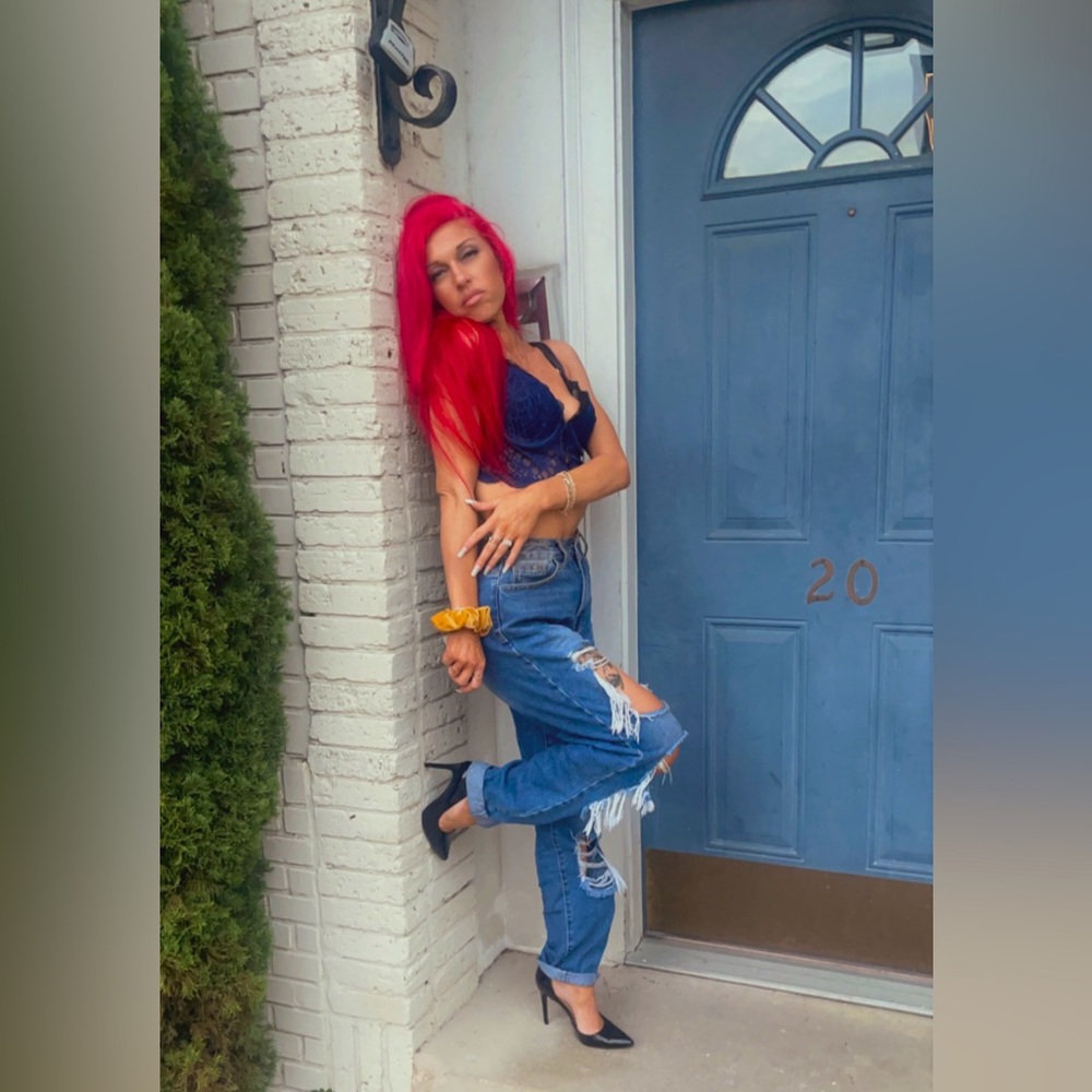 Adorable ripped boyfriends jeans paired w the perfect lingerie themed deep blue